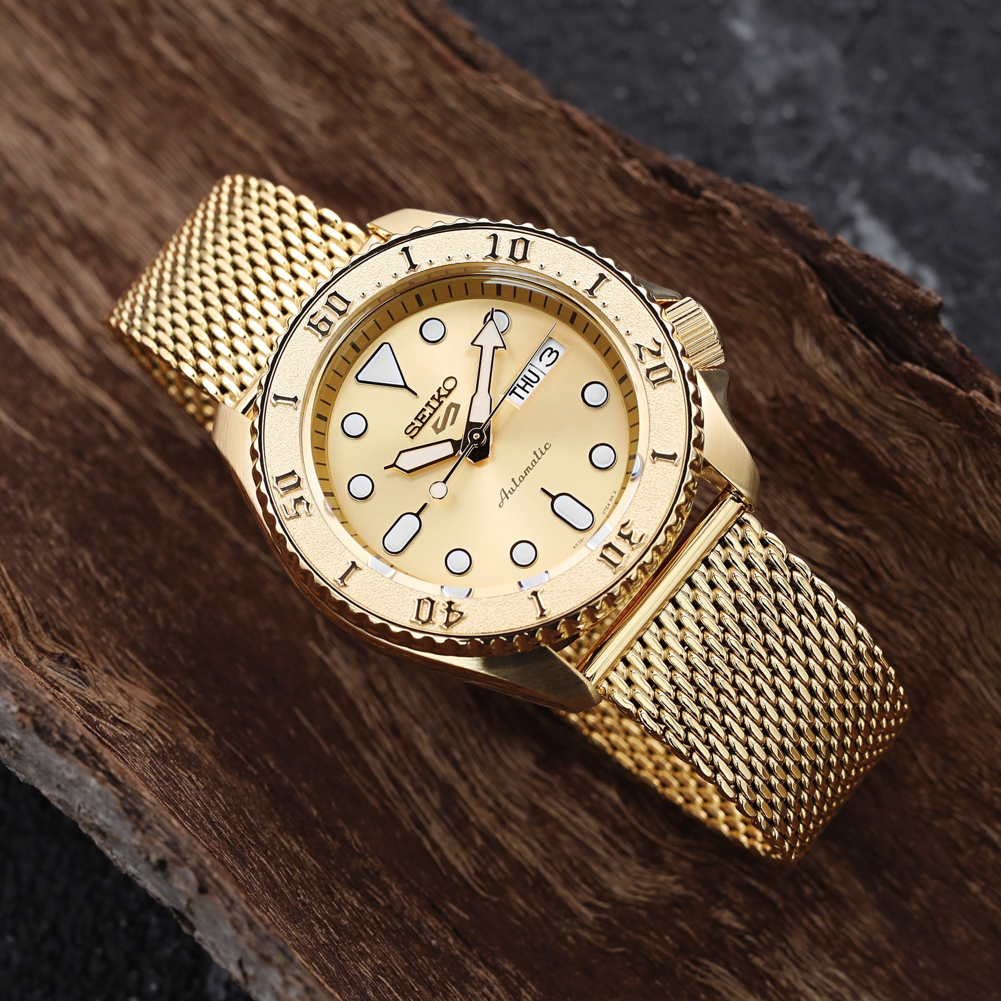 gold watch with a gold watch band